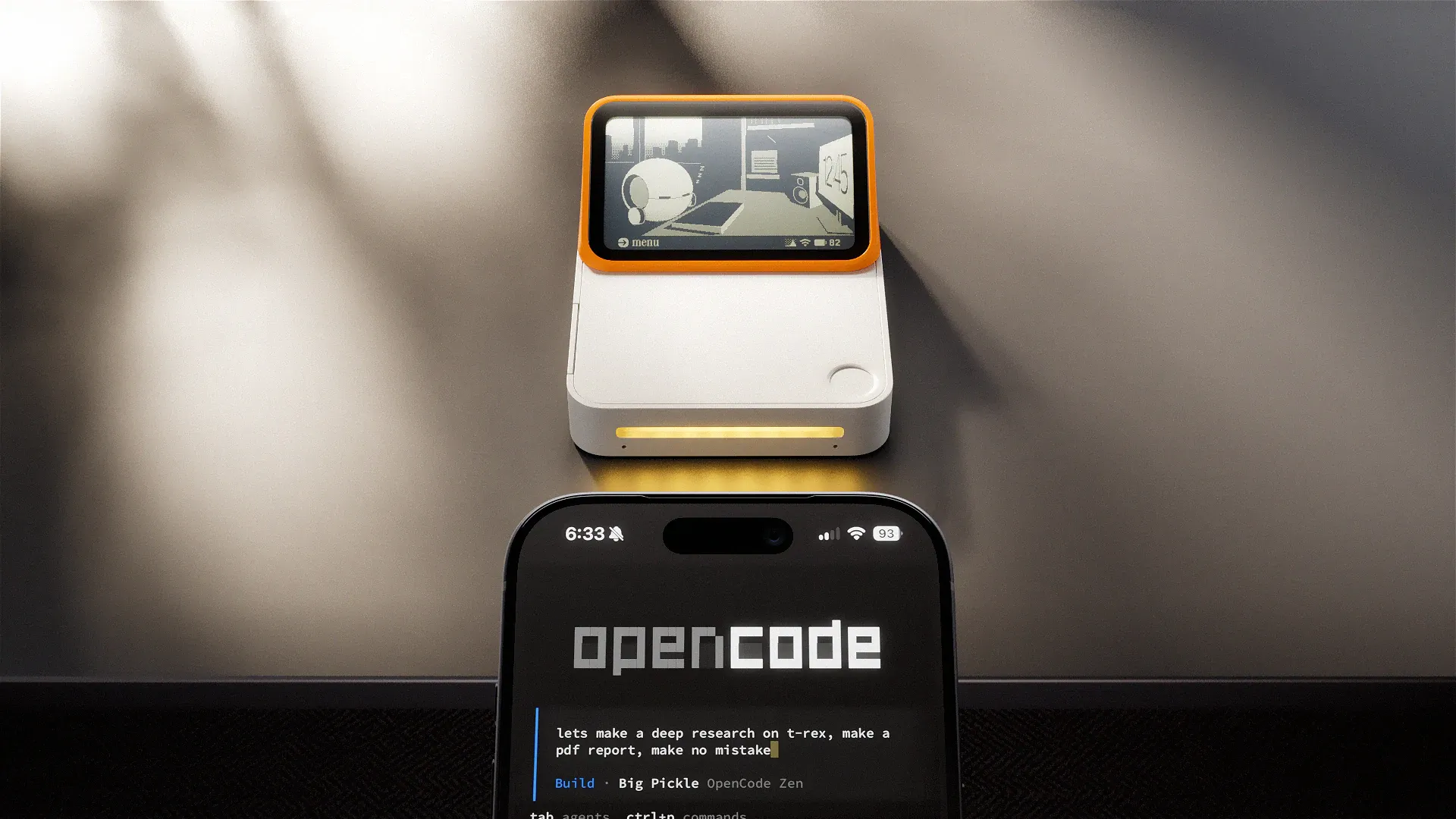 A Lapis One behind an iPhone showing an AI agent task in progress.
